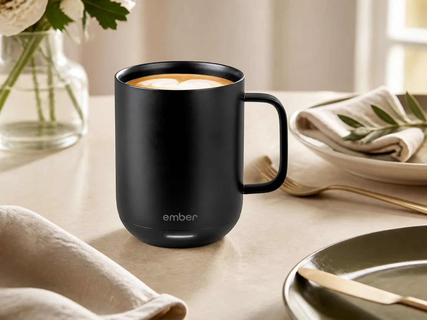 The exact black 14-ounce Ember Smart Mug 2 in a calm morning setting