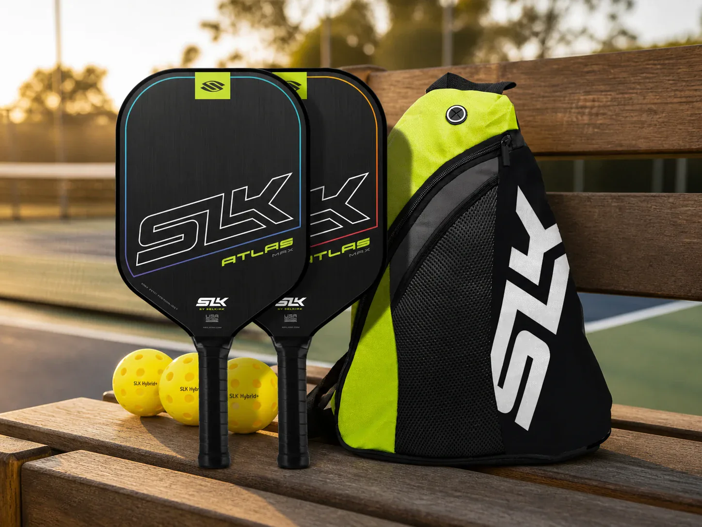 Selkirk SLK pickleball set with two paddles, balls, and carrying bag