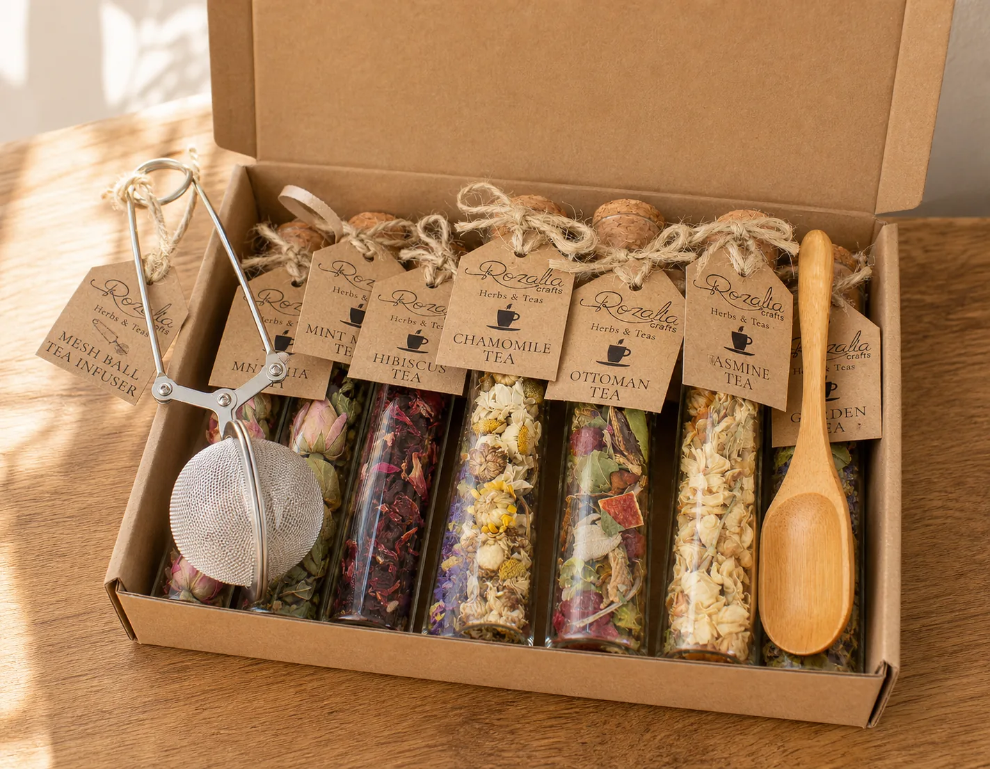 The exact tea sampler shown open with its glass tea tubes, infuser, and wooden spoon