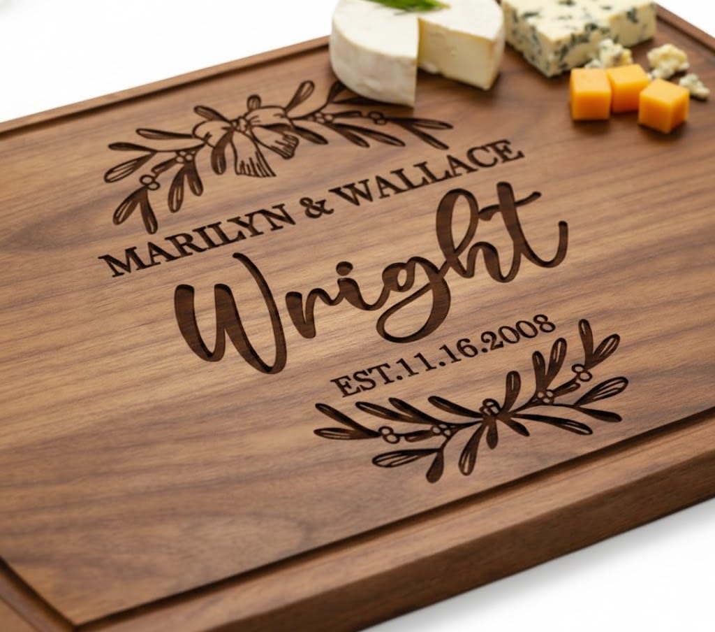 Dark wooden charcuterie board engraved with a couple's names and wedding date