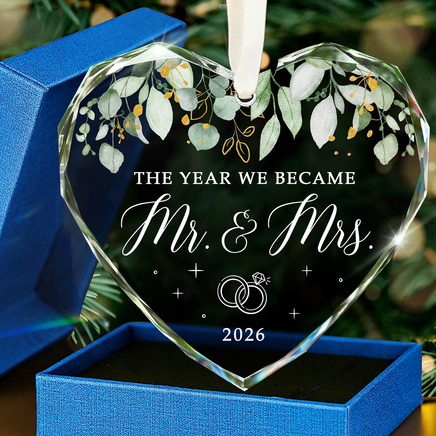 Heart-shaped glass ornament reading the year we became Mr and Mrs 2026