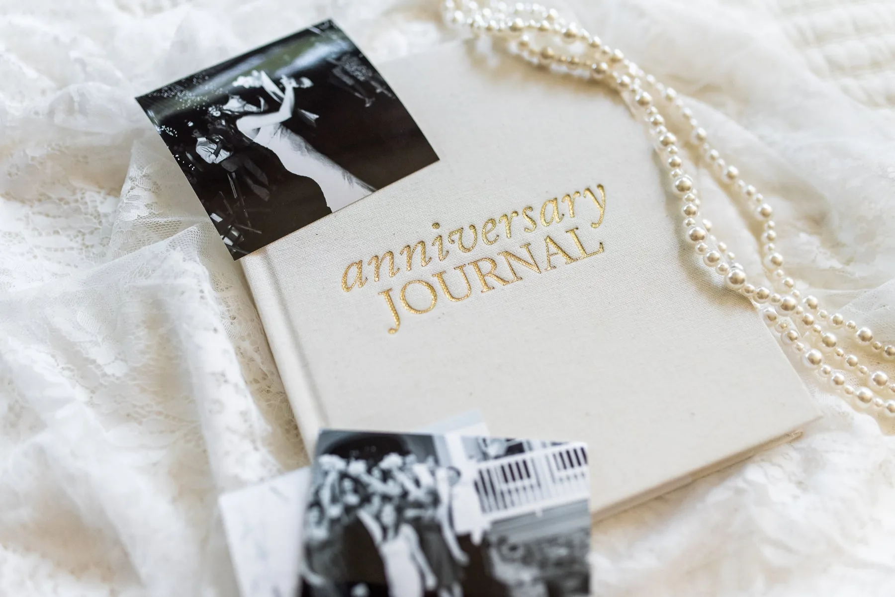 Wedding anniversary journal styled with wedding photographs