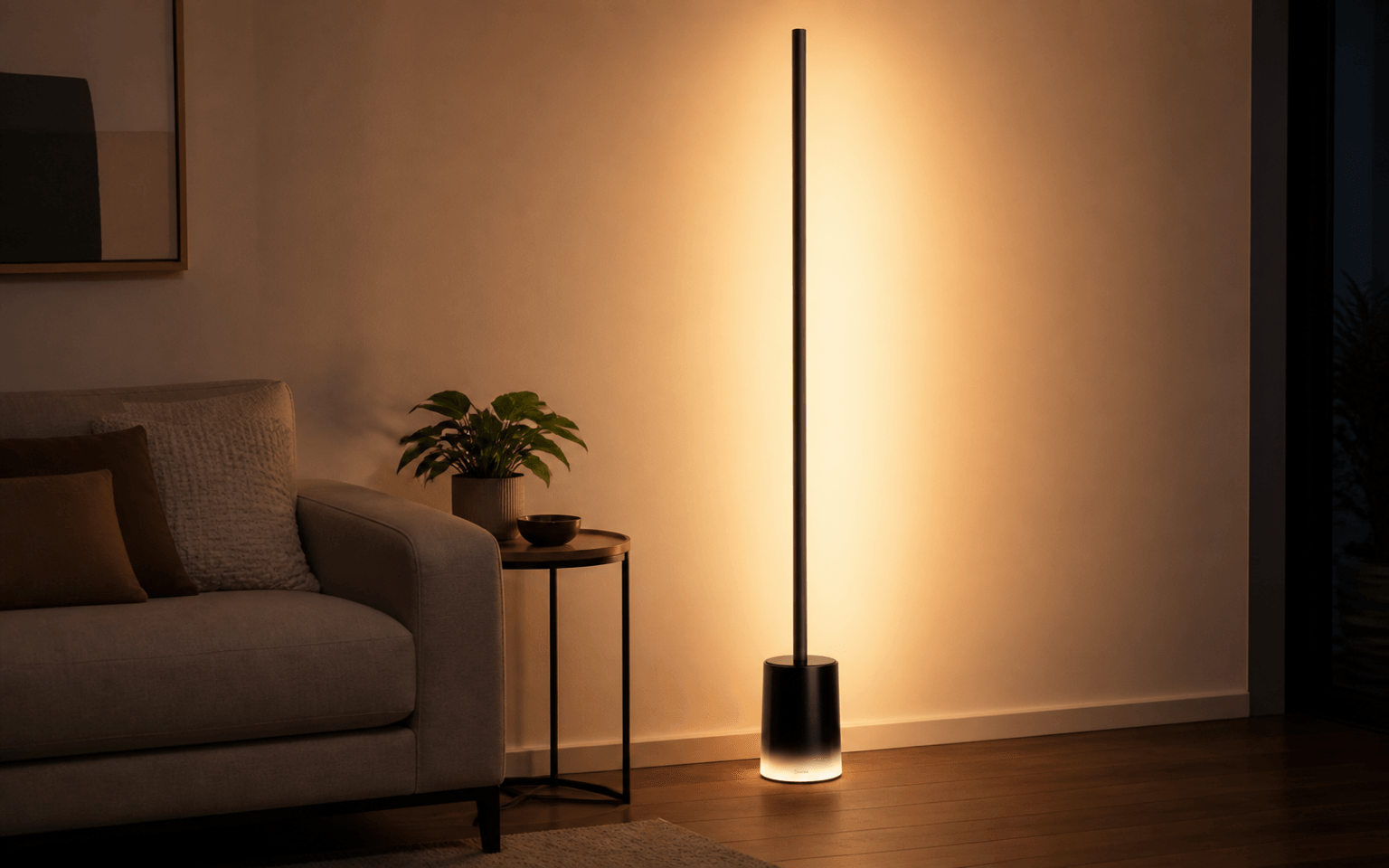 Black Govee Floor Lamp 2 casting warm light beside a neutral living-room sofa