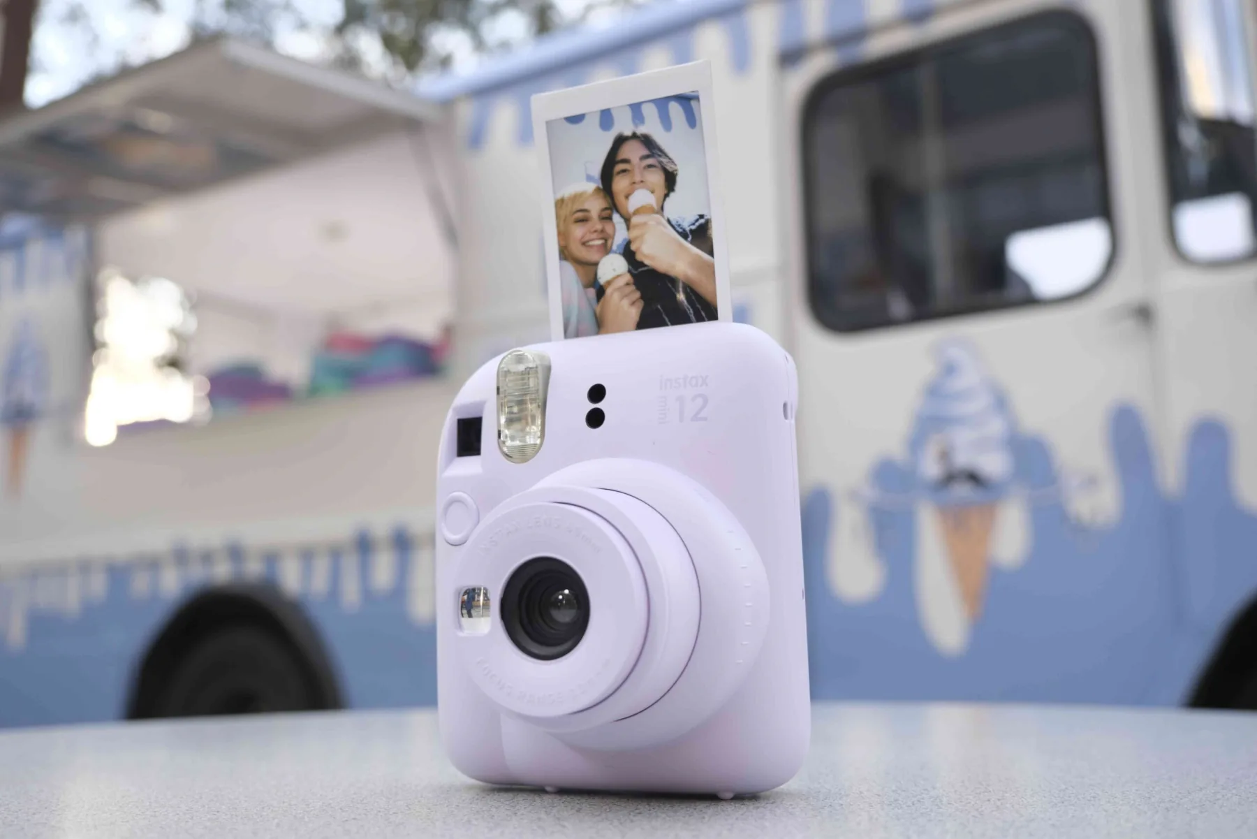 Lilac Fujifilm Instax Mini 12 with a couple's instant photo