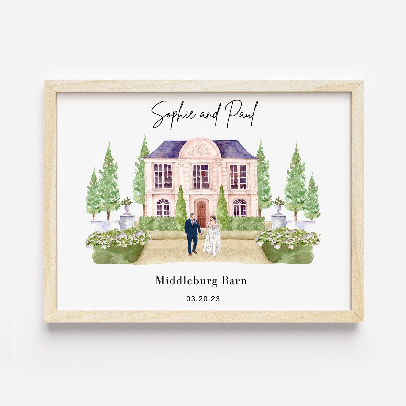 Framed custom watercolor portrait of a wedding venue personalized with couple names and date